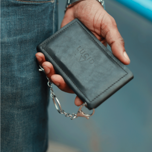 Lucid Ring/Stud Leather Wallet by Madi Lucent held in a hand